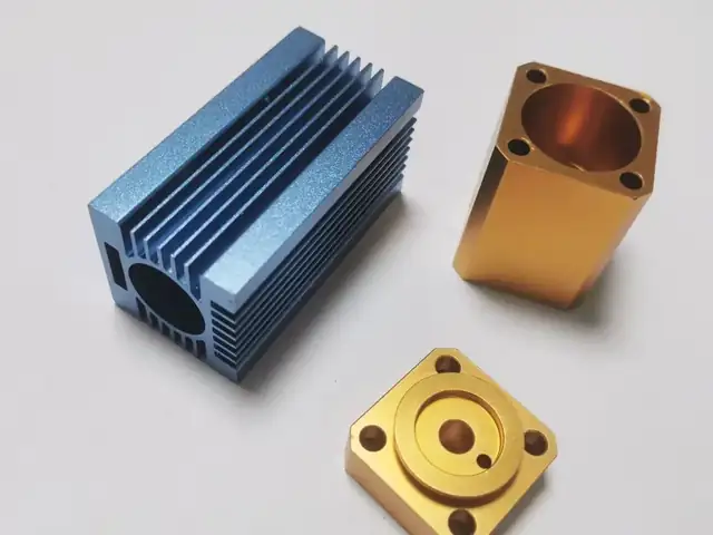 Anodised aluminium &mdash; blue heat sink and gold-anodised blocks, milled then finished
